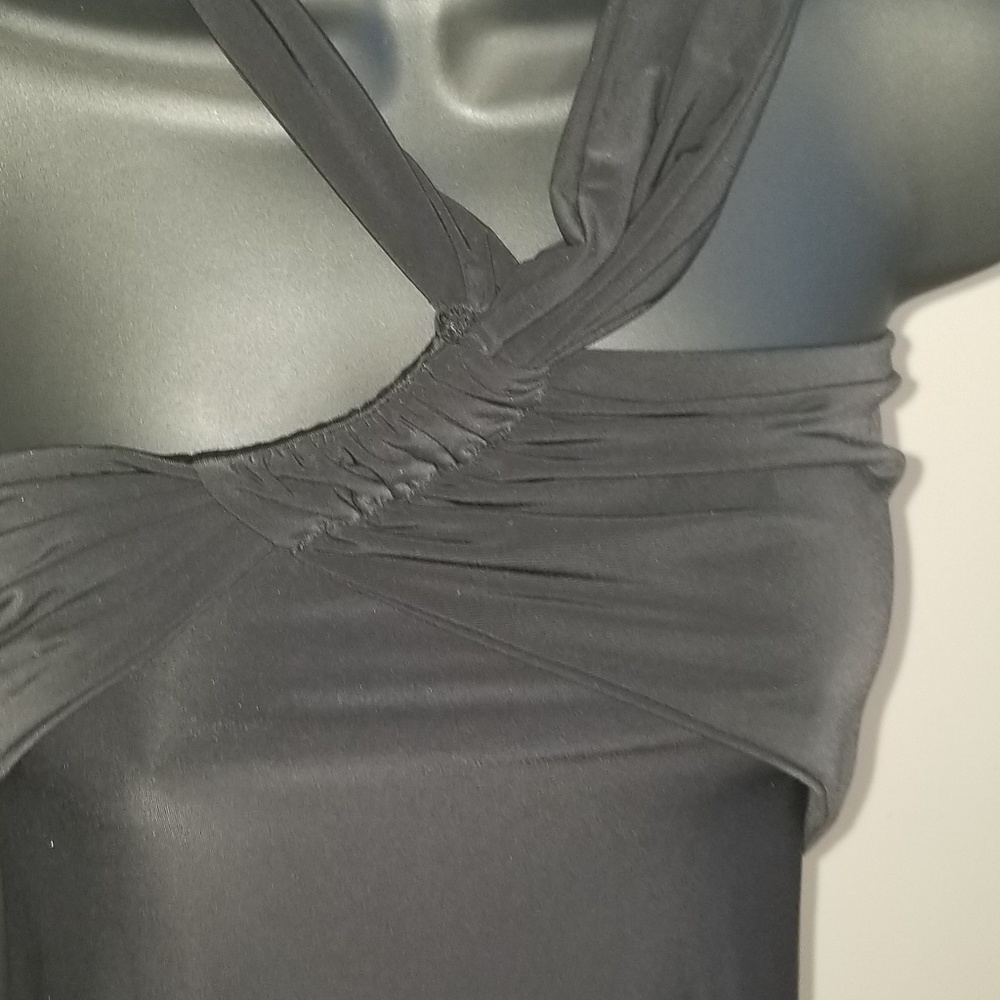 Black Halter top 90 % Polyester and 5% Spandex.